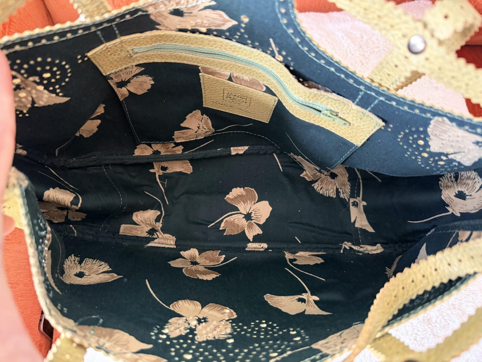 Interior view of the JAMIN PUECH DELICATE DETAIL HANDBAG showing floral pattern and intricate lace design.