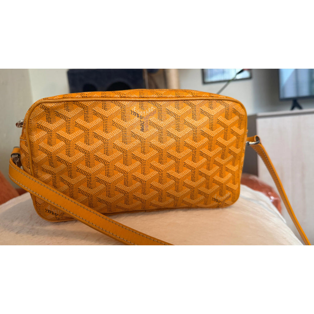 GOYARD YELLOW CAP VERT CROSSBODY BAG in Goyardine pattern with yellow and brown design.