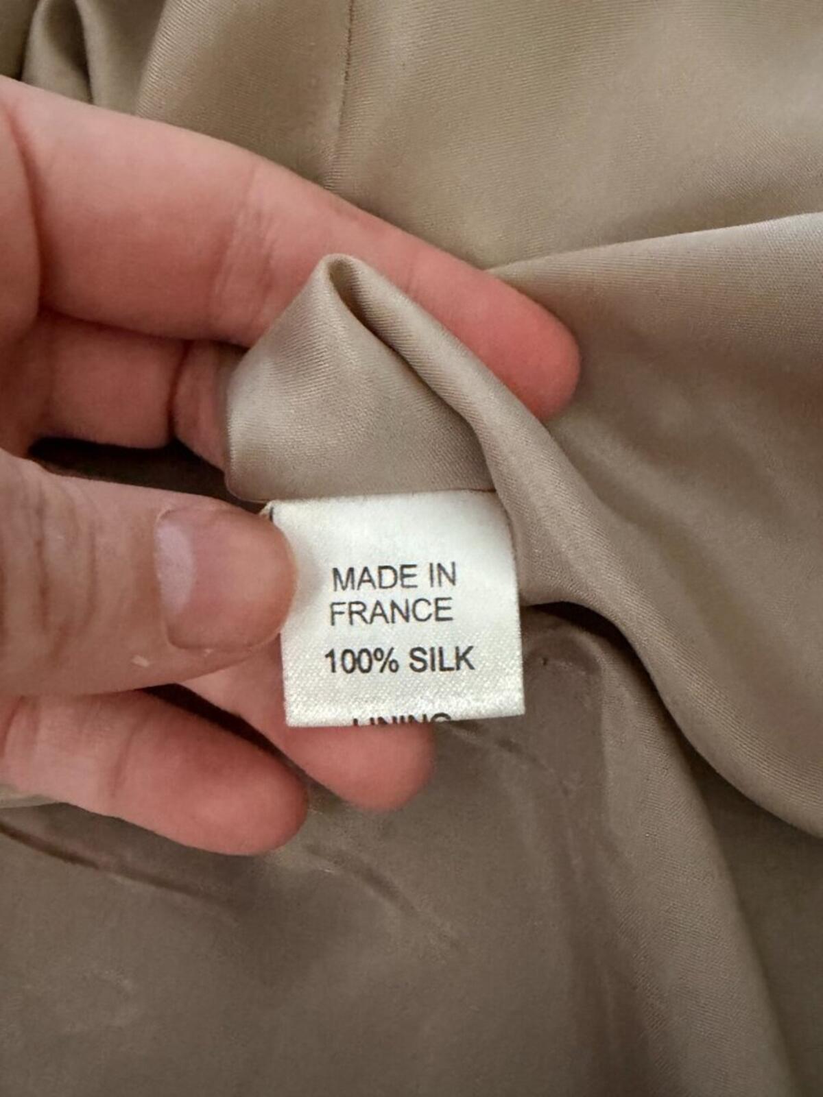 Made in France label on a silk garment, indicating 100% silk fabric quality.