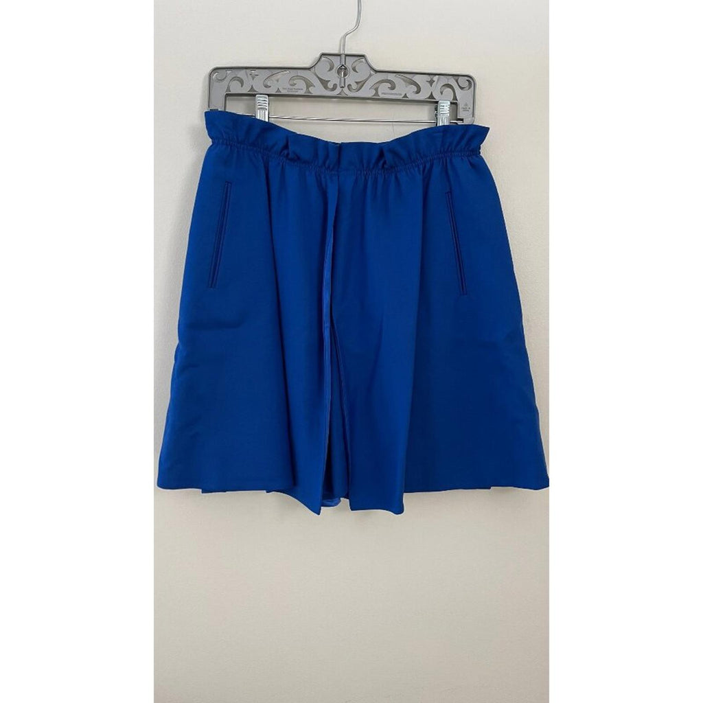 GIORGIO ARMANI BLACK LABEL BLUE LAYERED SKIRT displayed on a hanger, featuring dual pockets and a split design.