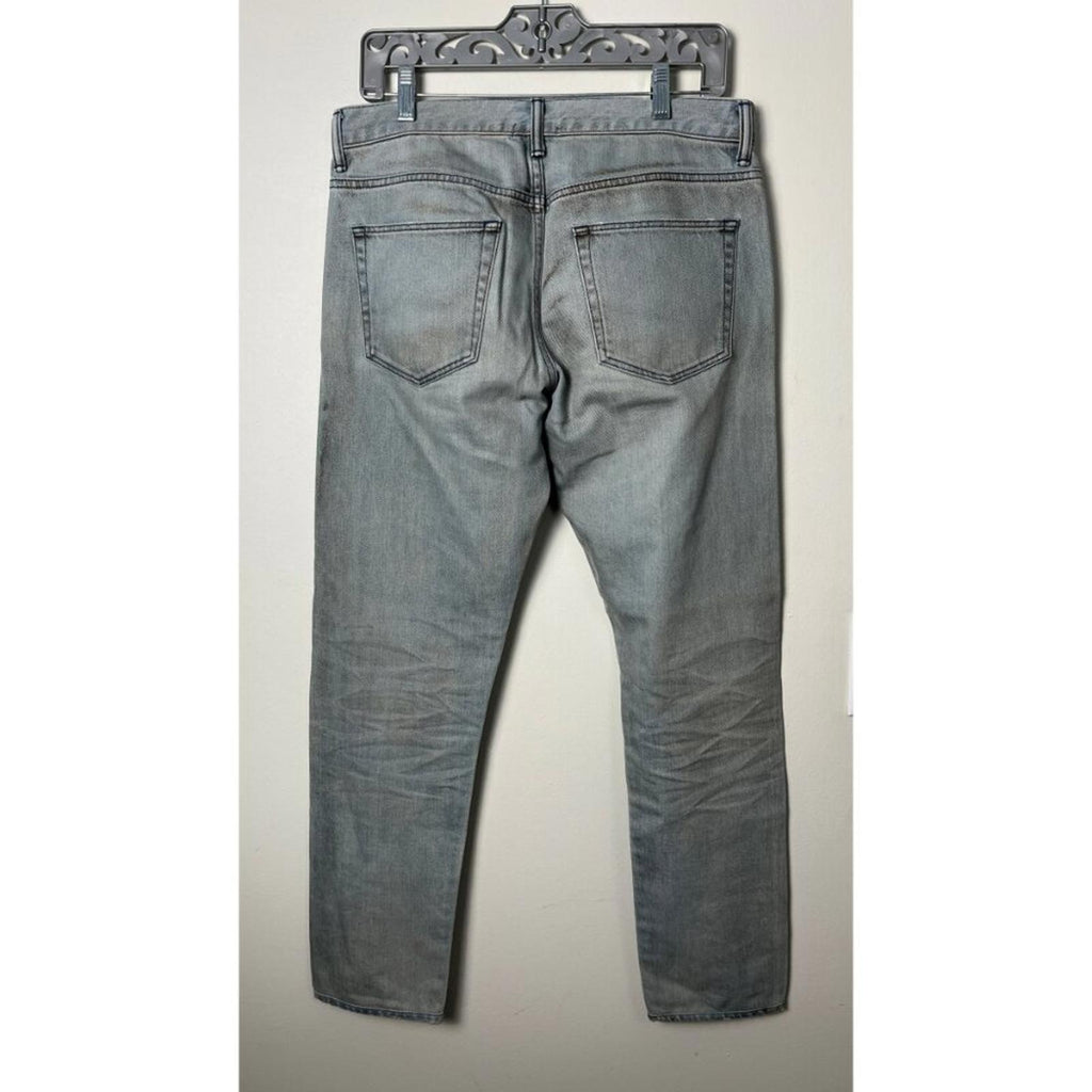 Back view of JOHN ELLIOTT THE CAST 2 SPRING DIRTY JEANS, showcasing slim tapered fit and factory staining.