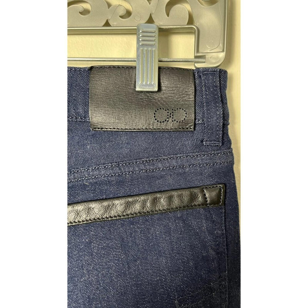 Close-up view of SALVATORE FERRAGAMO DARK NAVY CROPPED DENIM JEANS showing the waistband and leather detailing.