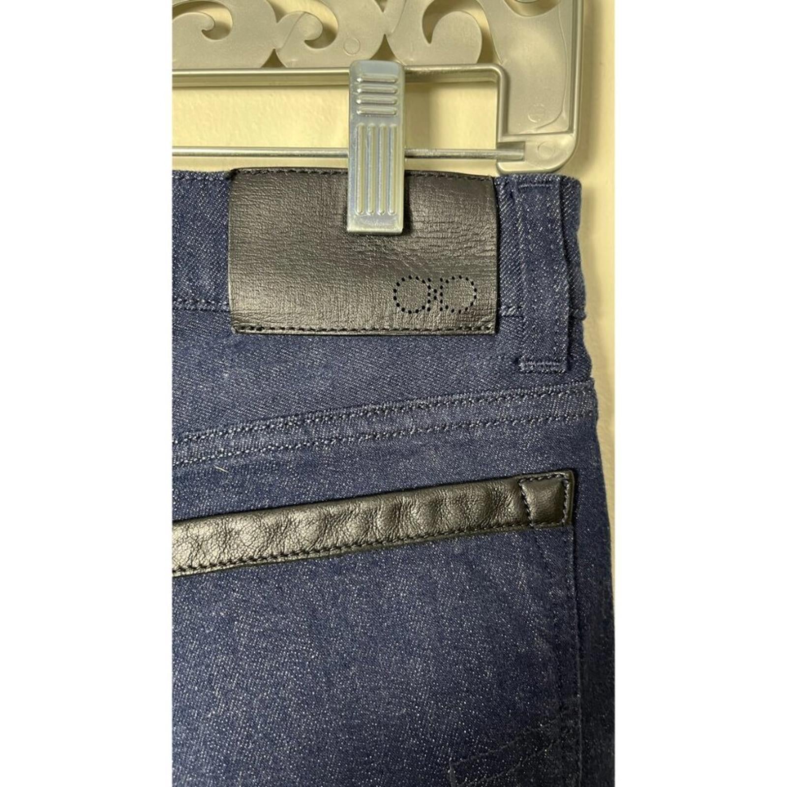 Close-up view of SALVATORE FERRAGAMO DARK NAVY CROPPED DENIM JEANS showing the waistband and leather detailing.