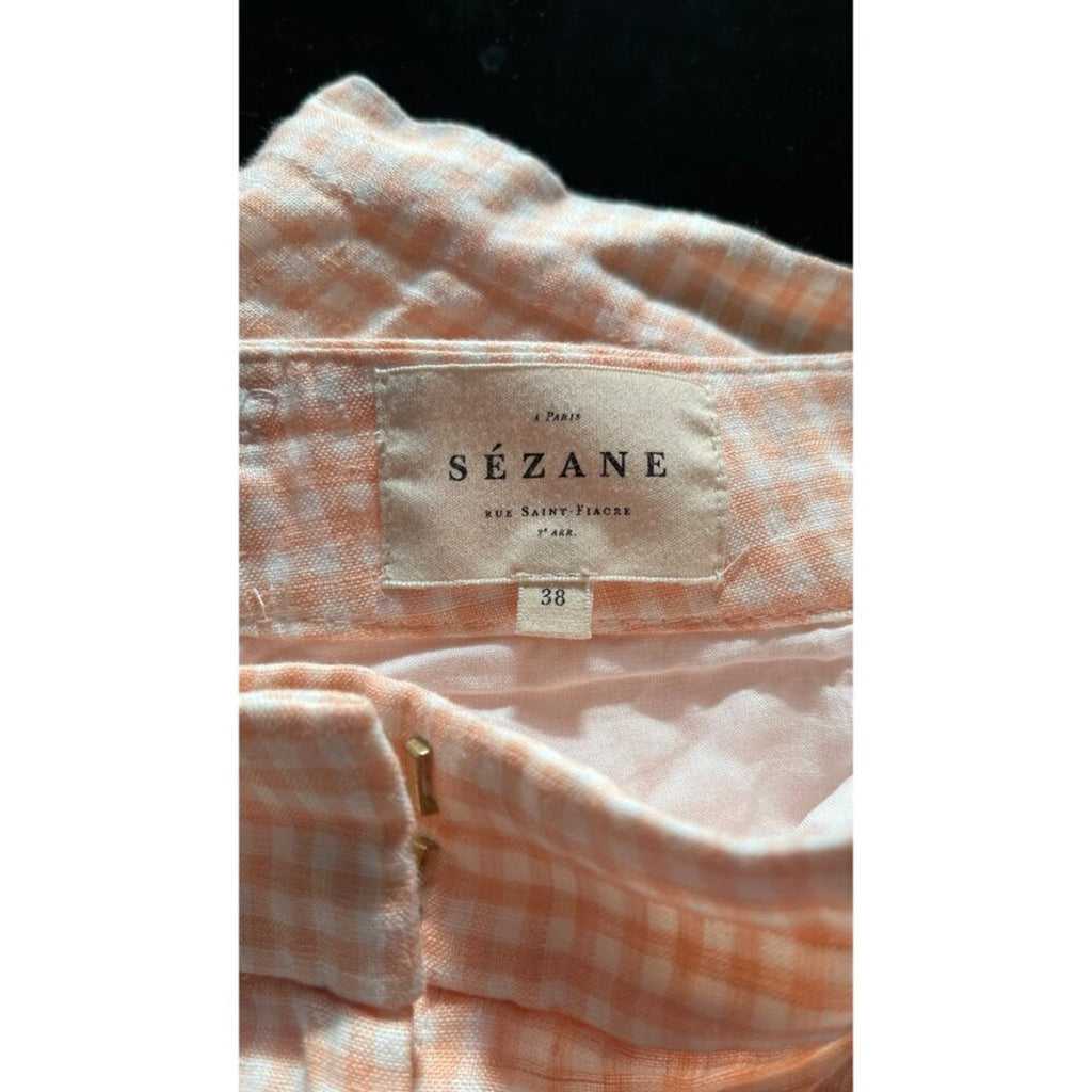 SEZANE GINGHAM PLAID SHORTS 38 label showing size 38 in excellent condition on a pink checked fabric.