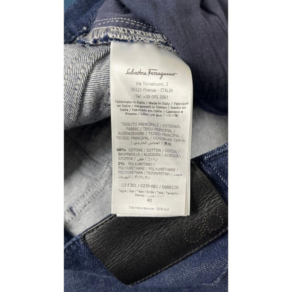 Label of SALVATORE FERRAGAMO DARK NAVY CROPPED DENIM JEANS showing fabric composition and care instructions.