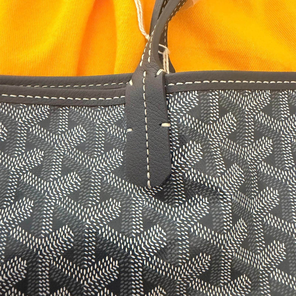 Goyard St. Louis bag GM- Goyardine close-up of handle detail on vibrant background