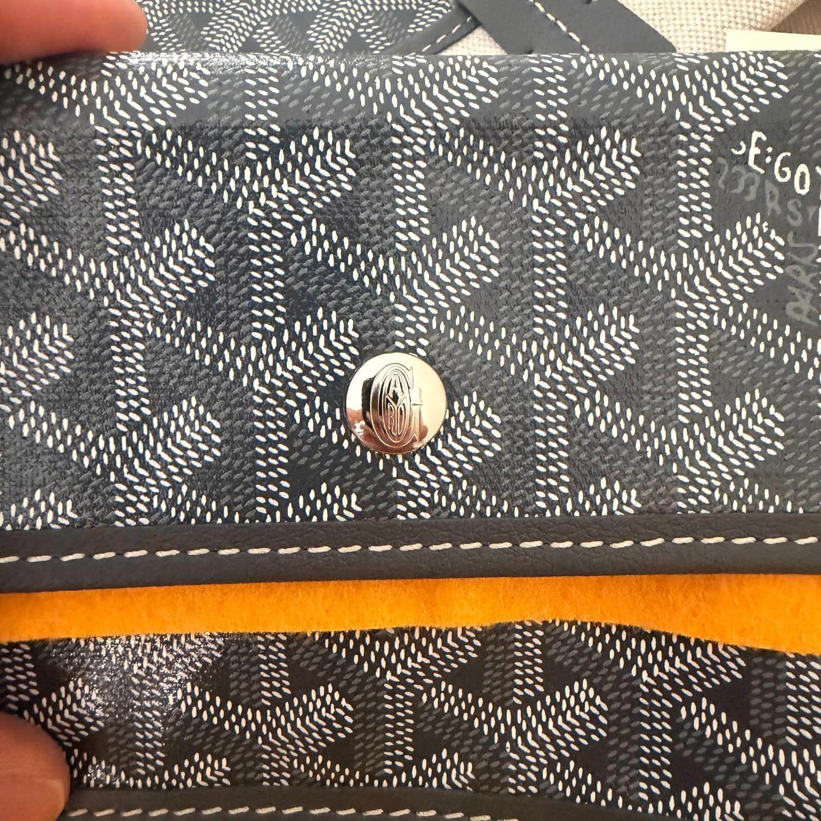 Interior detail of the Goyard St. Louis bag GM- Goyardine showing the signature pattern and hardware.