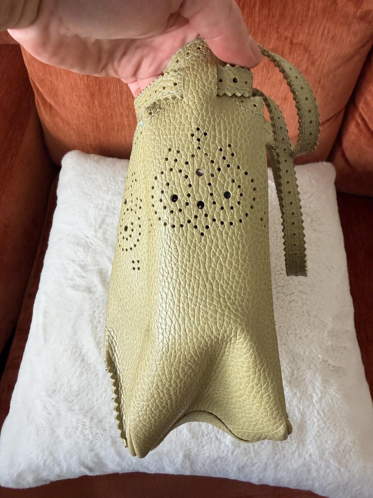 JAMIN PUECH DELICATE DETAIL HANDBAG showcasing intricate lace perforated detail and unique chartreuse color.