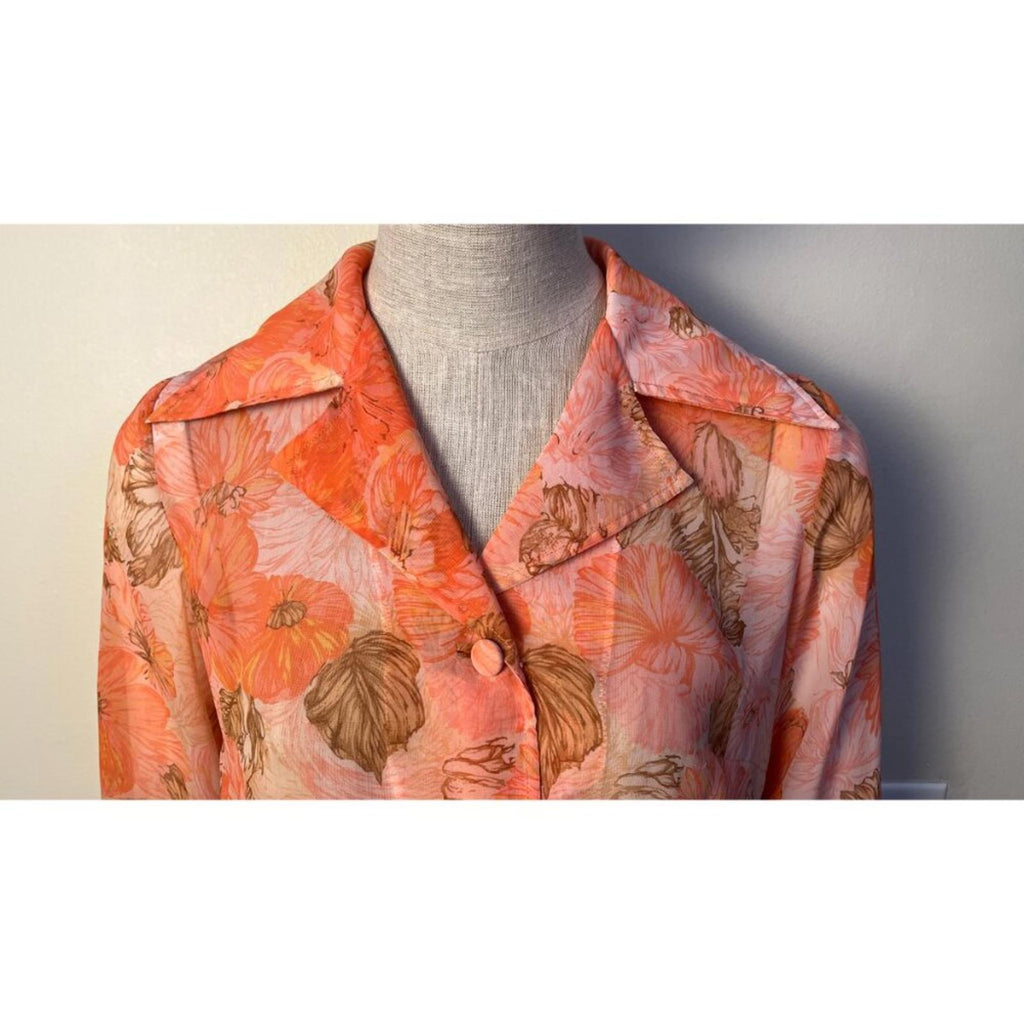 VINTAGE FLORAL 50'S 60'S SHEER JACKET displayed on a mannequin, showcasing vibrant floral patterns and collar design.