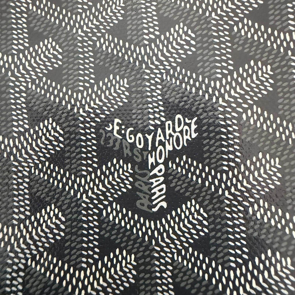 Close-up of Goyard St. Louis bag GM- Goyardine pattern showing brand logo and signature design.