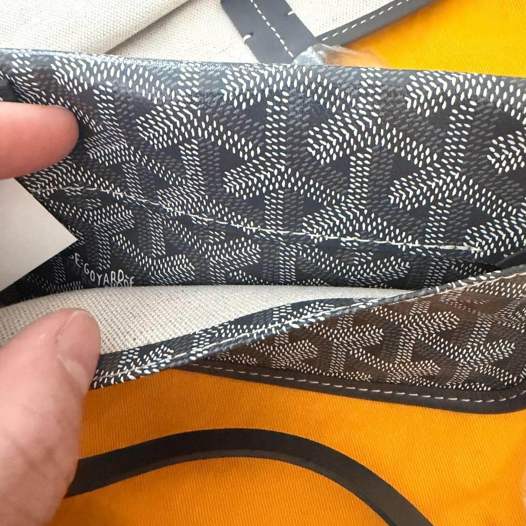 Interior view of the authentic Goyard St. Louis bag GM- Goyardine showing straps and lining.