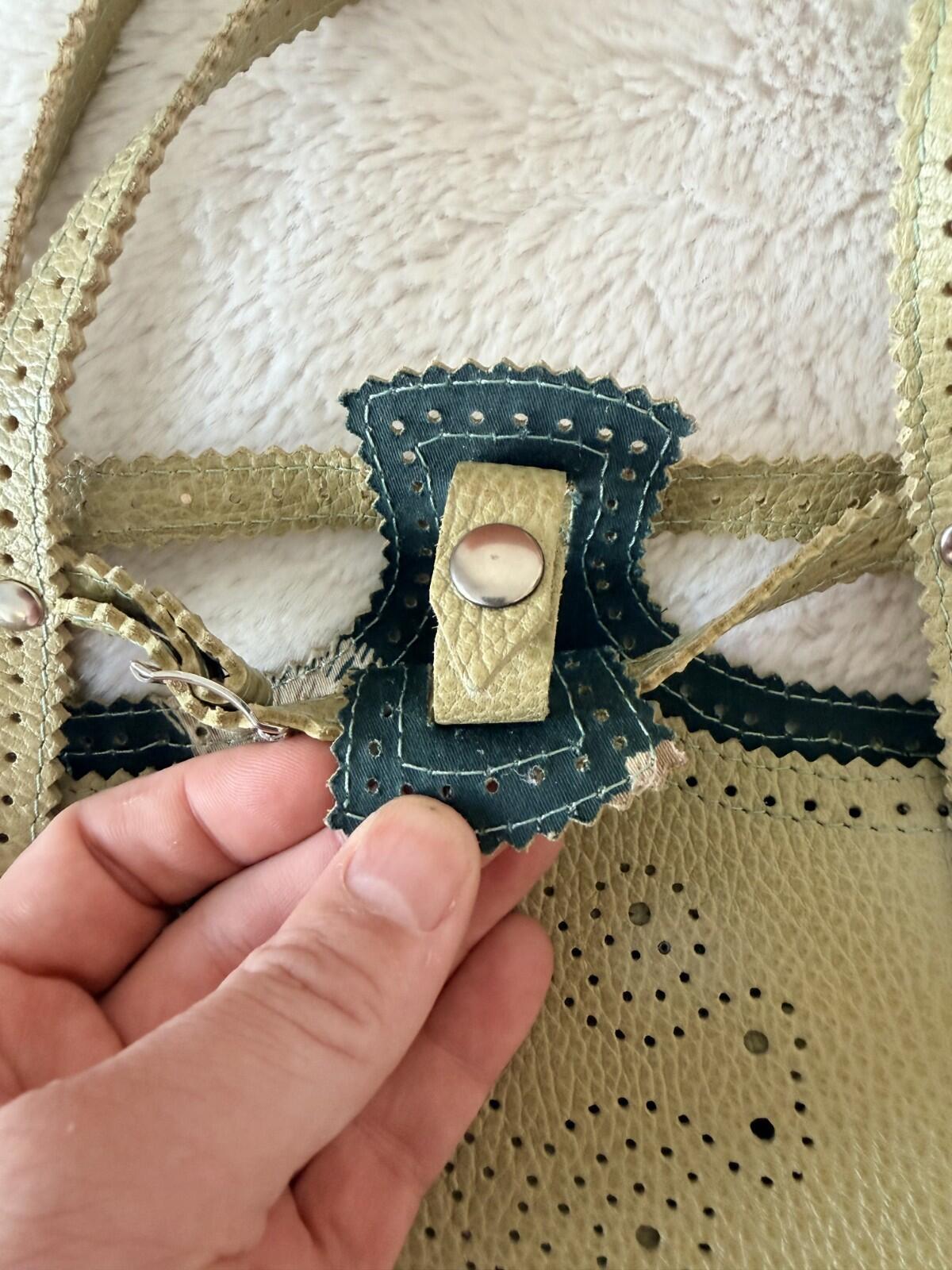 Close-up of the clasp detail on the JAMIN PUECH DELICATE DETAIL HANDBAG showcasing exquisite craftsmanship.