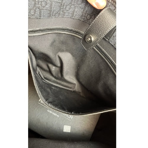 Interior view of CHRISTIAN DIOR KIM JONES BLACK OBLIQUE MONOGRAM TOTE BAG showing pristine condition and detailing.