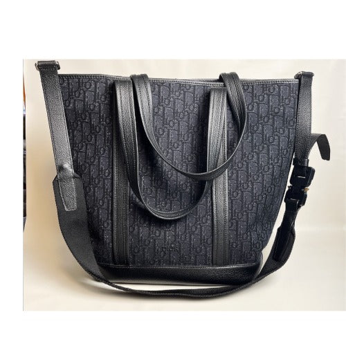 CHRISTIAN DIOR KIM JONES BLACK OBLIQUE MONOGRAM TOTE BAG with removable shoulder strap, showcased in pristine condition.