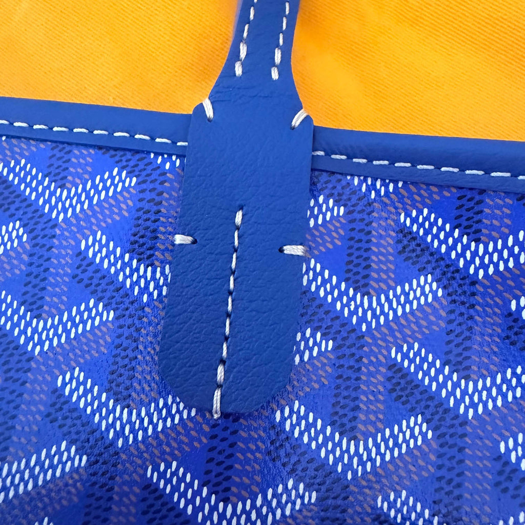 Close-up of Goyard Artois MM Tote Bag- Goyardine showcasing the blue leather and signature pattern.