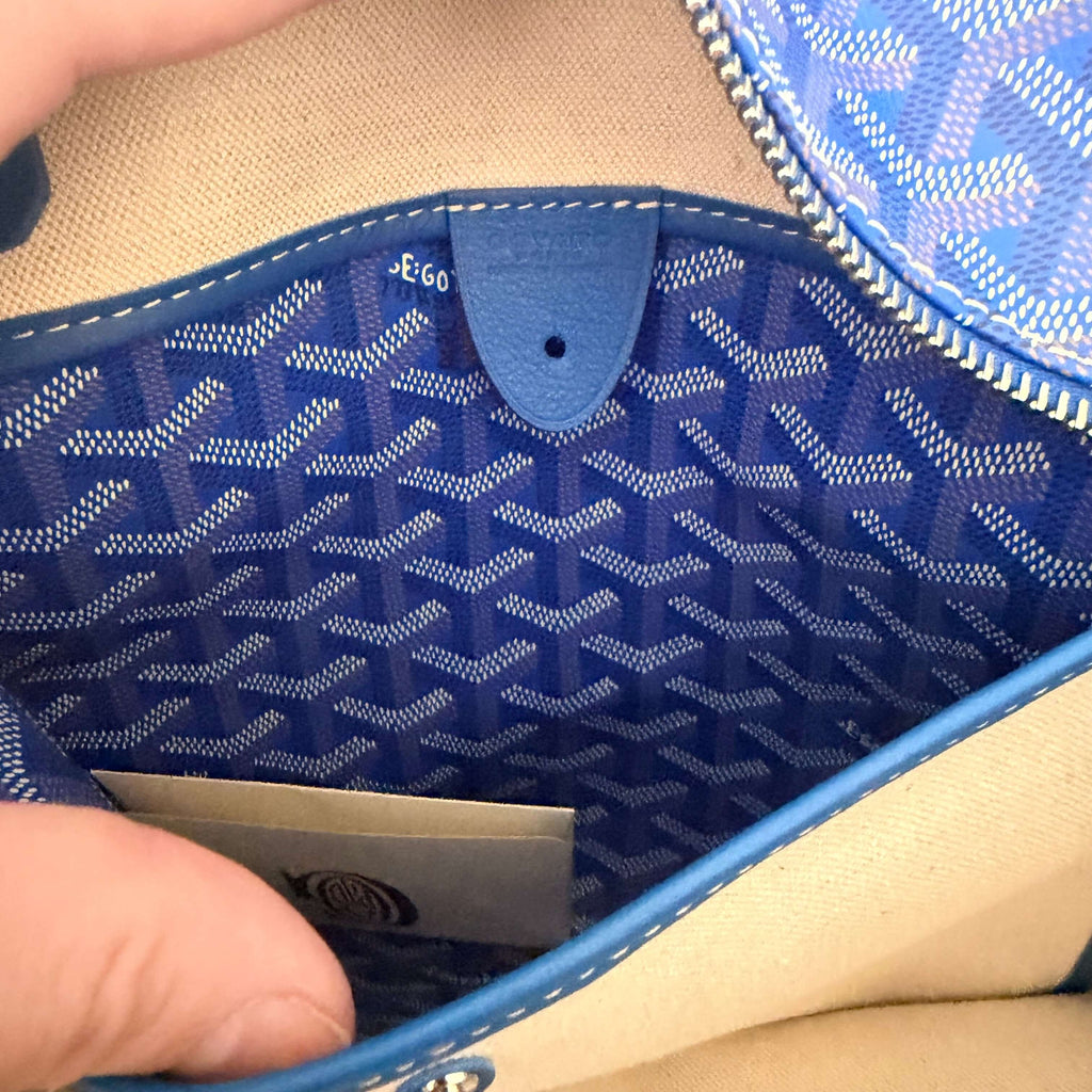 Interior view of the Goyard Artois MM Tote Bag- Goyardine showing blue patterned lining and interior pocket.