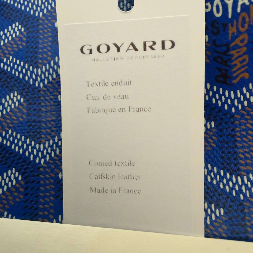 Goyard Artois MM Tote Bag- Goyardine care tag detailing materials and origin.