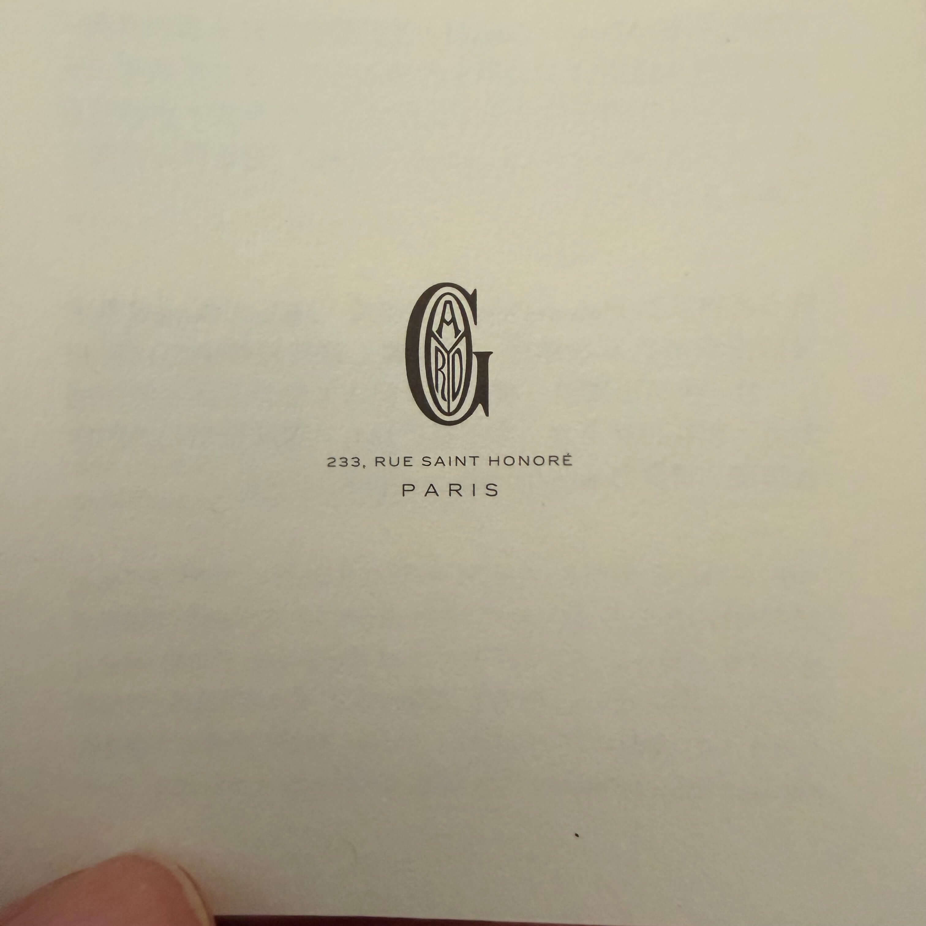 Goyard logo and address at 233 Rue Saint Honoré, Paris, featured inside a product documentation.
