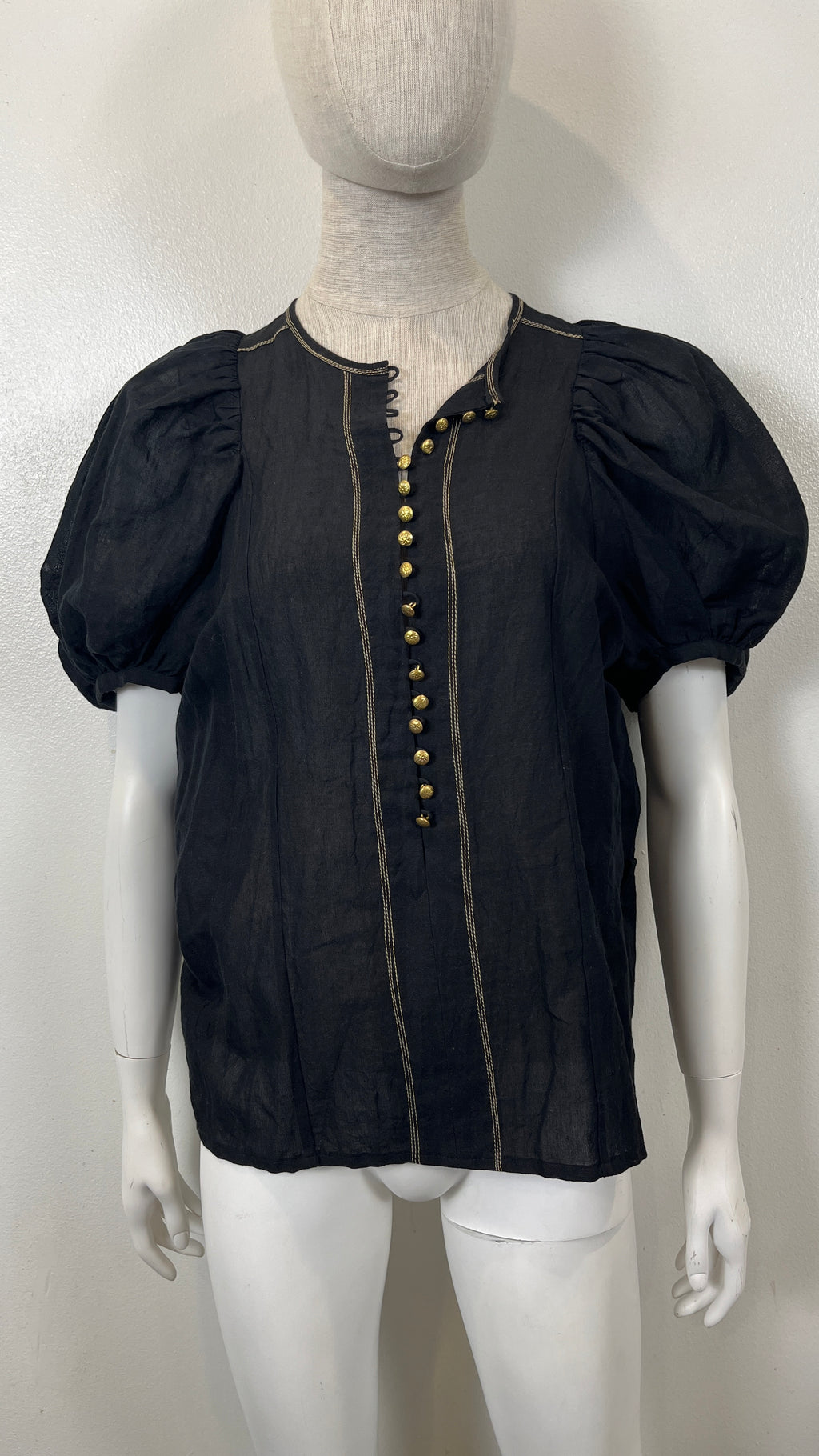 NATIVE VILLAGE LINEN BOHO SHEER BLOUSE displayed on a mannequin, featuring puff sleeves and decorative buttons.