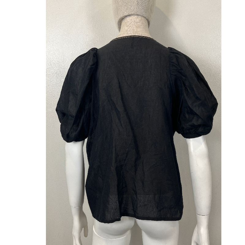 Back view of the NATIVE VILLAGE LINEN BOHO SHEER BLOUSE showcasing its puffed sleeves and lightweight fabric.