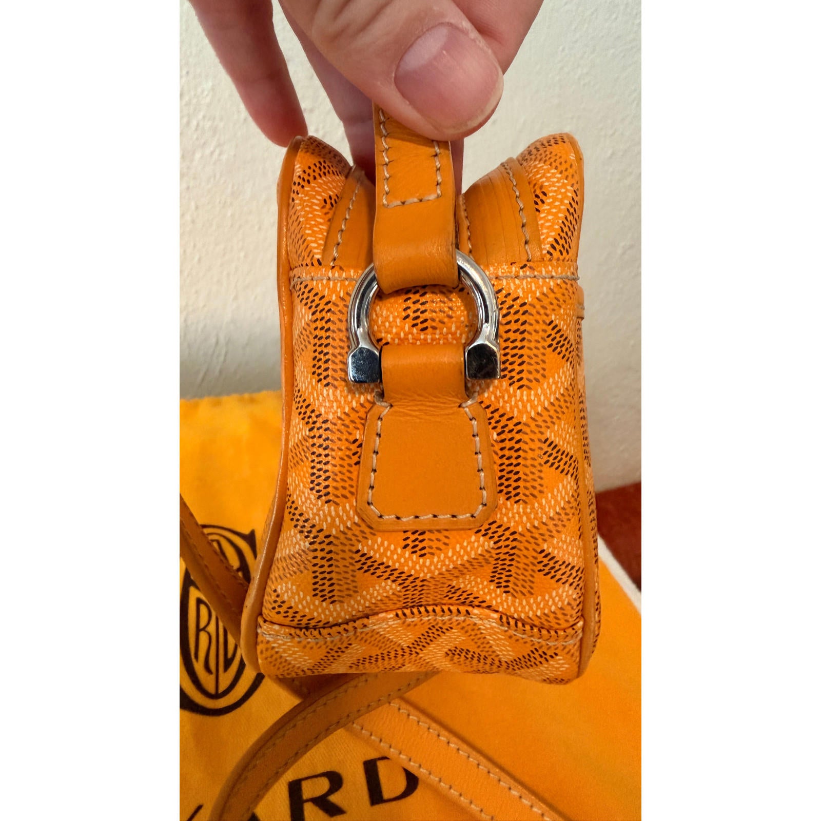 Detail of GOYARD YELLOW CAP VERT CROSSBODY BAG showcasing the unique Goyardine pattern and adjustable strap.