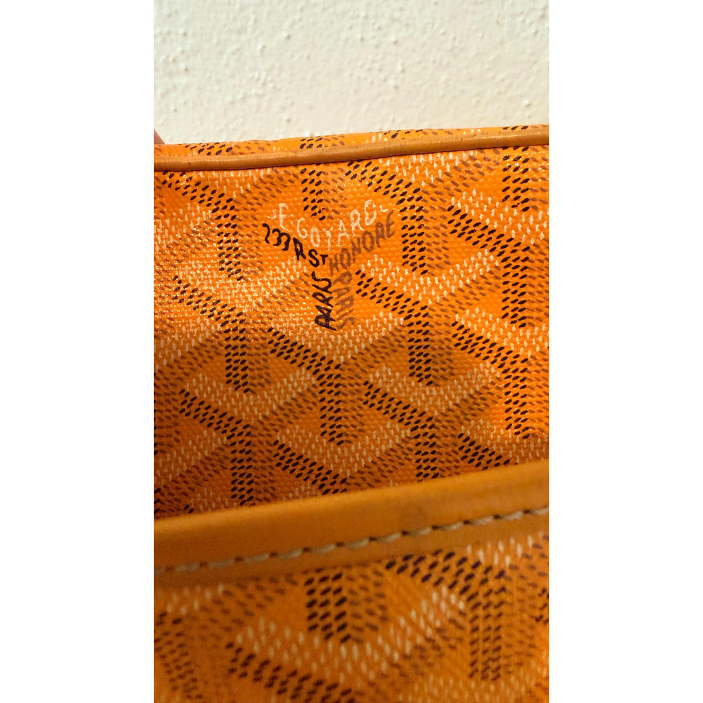 Interior view of authentic Goyard yellow Cap Vert crossbody bag showcasing Goyardine pattern and hardware details.