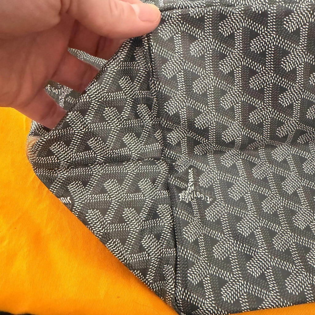 Interior view of Goyard St. Louis bag GM- Goyardine showing the patterned lining and straps.