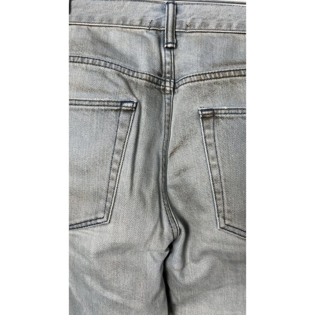 Back view of JOHN ELLIOTT THE CAST 2 SPRING DIRTY JEANS, showcasing the design and factory staining details.