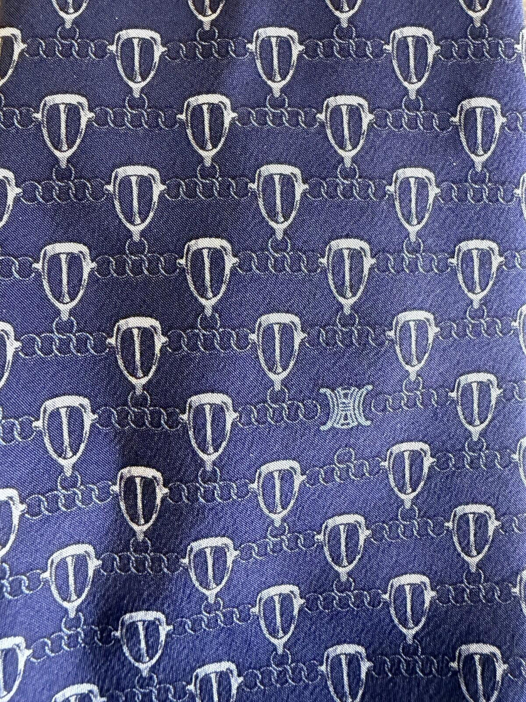 CELINE GEOMETRIC LOGO PRINT NECK TIE fabric pattern featuring a unique geometric design on a rich blue background.