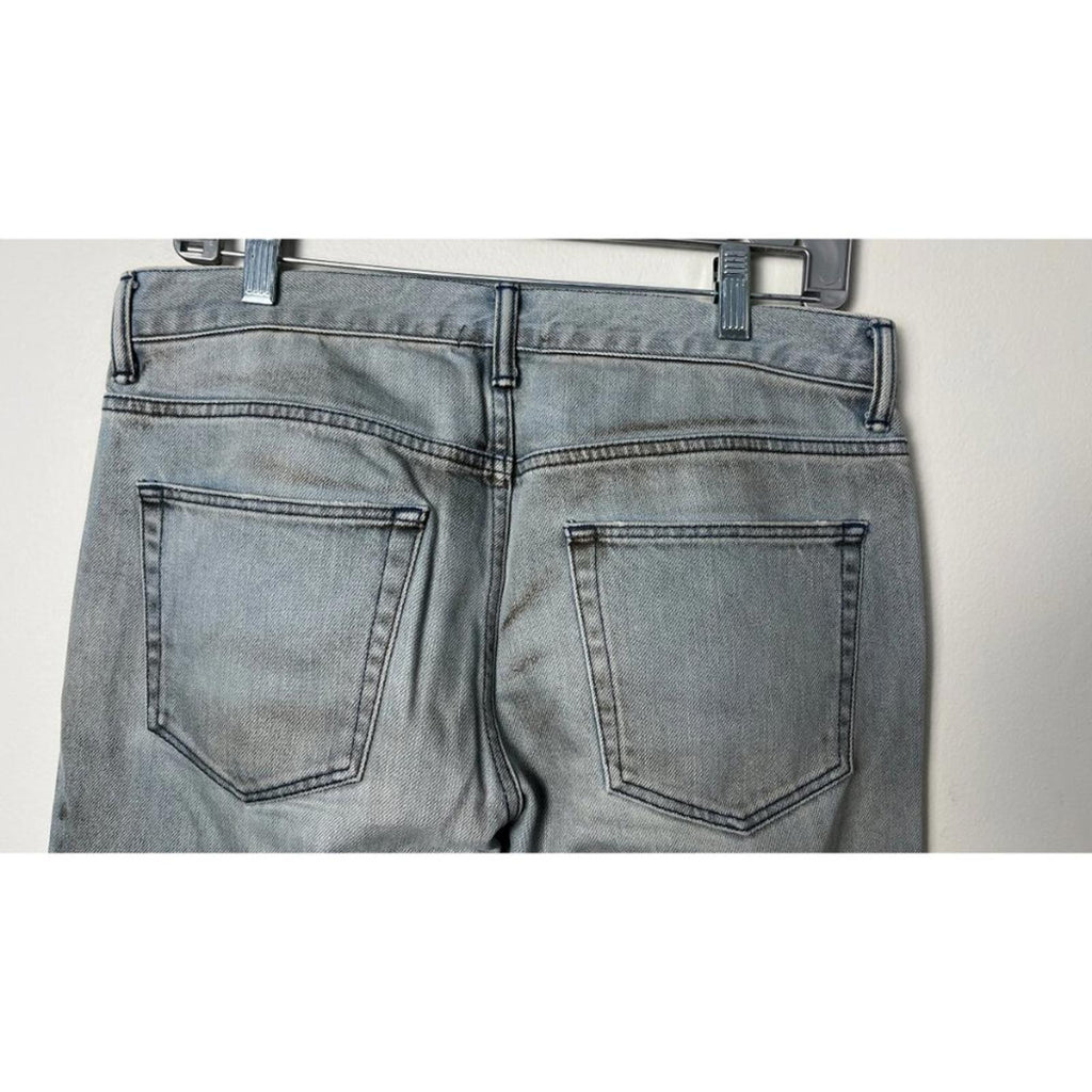 Back view of JOHN ELLIOTT THE CAST 2 SPRING DIRTY JEANS displaying pockets and factory staining.