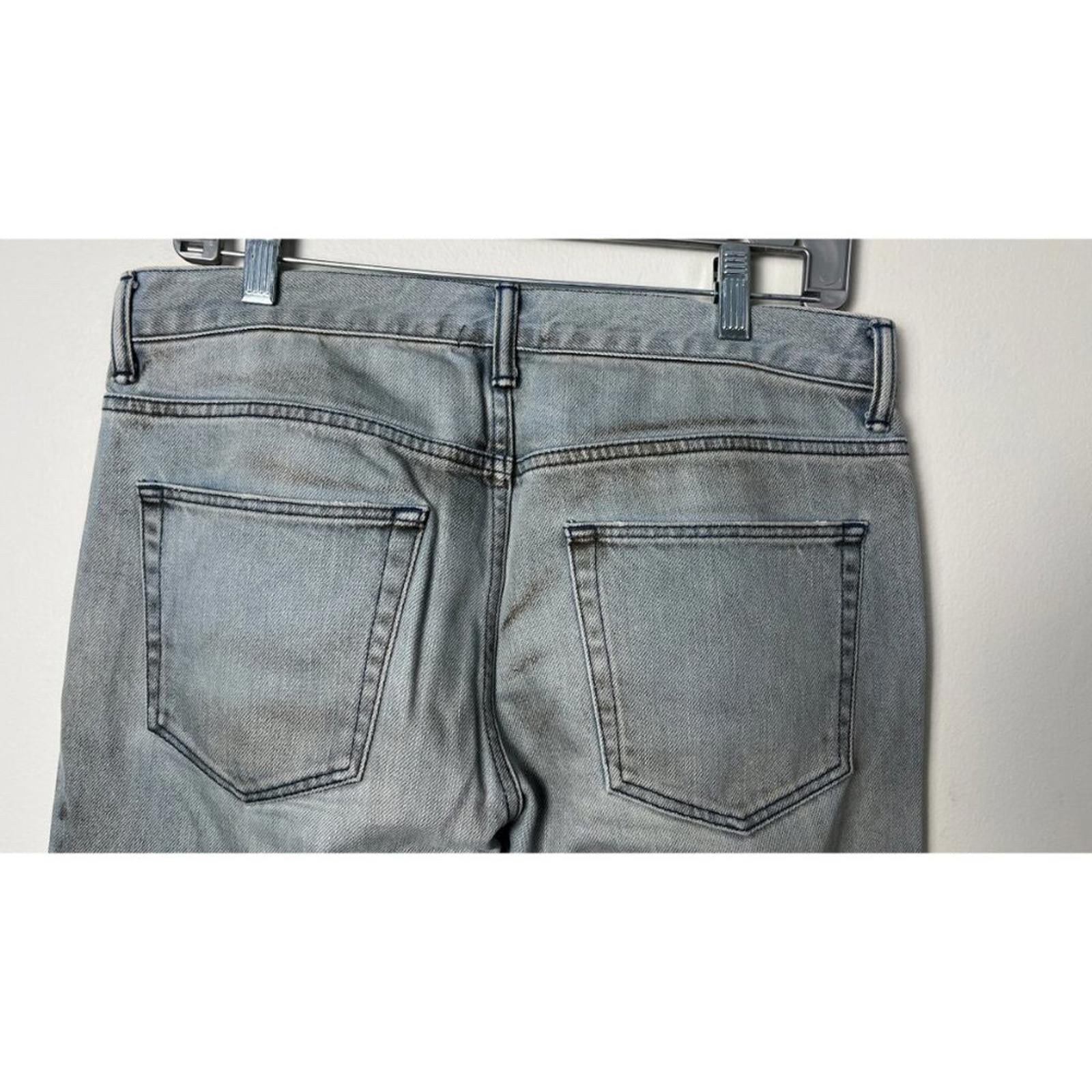 Back view of JOHN ELLIOTT THE CAST 2 SPRING DIRTY JEANS displaying pockets and factory staining.