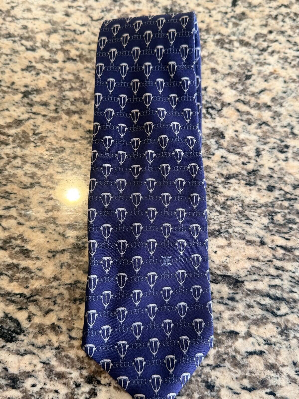 CELINE GEOMETRIC LOGO PRINT NECK TIE featuring a unique geometric pattern on a blue background.