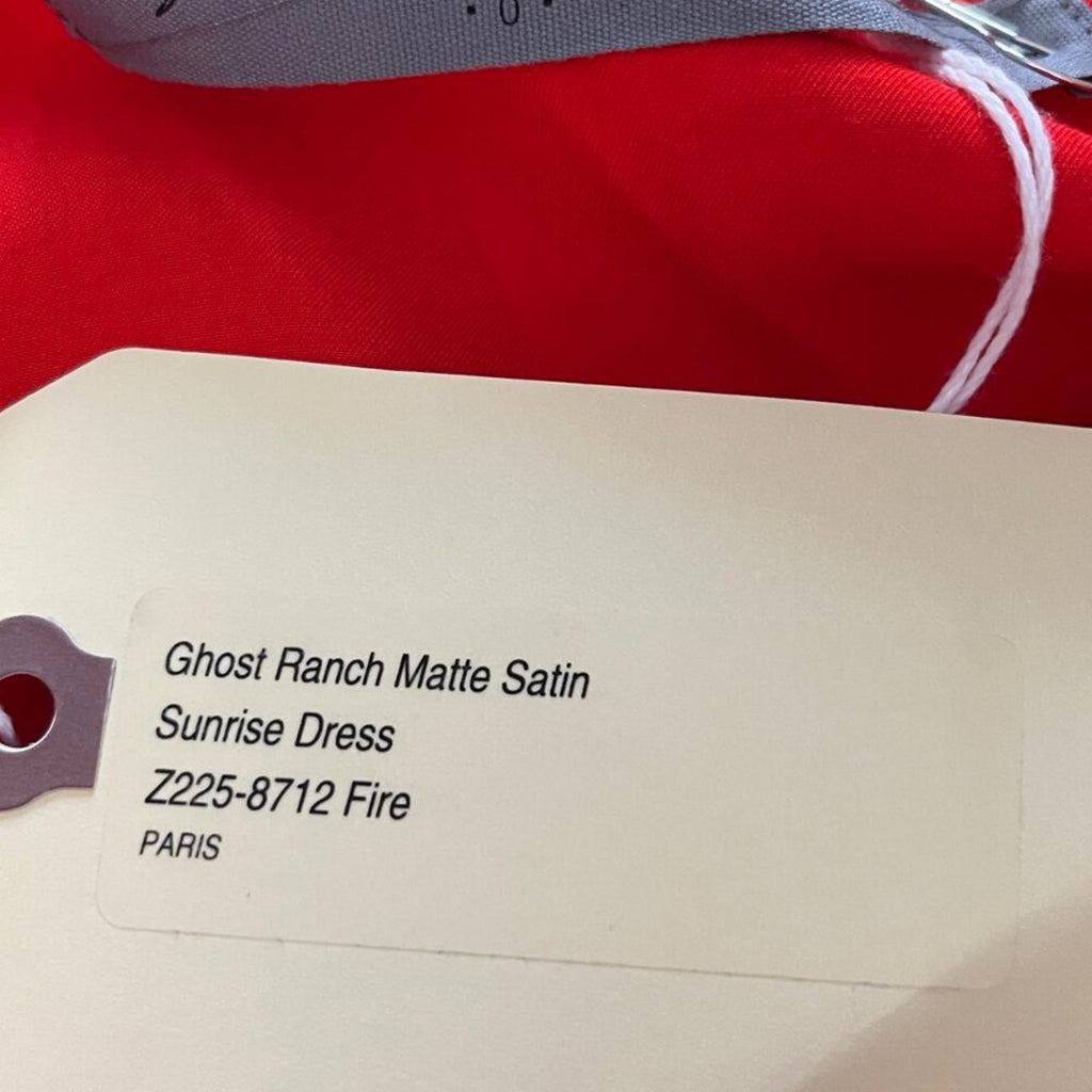 Label showing Ghost Ranch Matte Satin Sunrise Dress, product details including Z225-8712 Fire and PARIS.