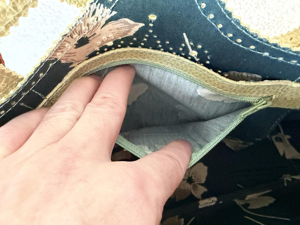 Interior pocket of the JAMIN PUECH DELICATE DETAIL HANDBAG showcasing its soft lining and craftsmanship.