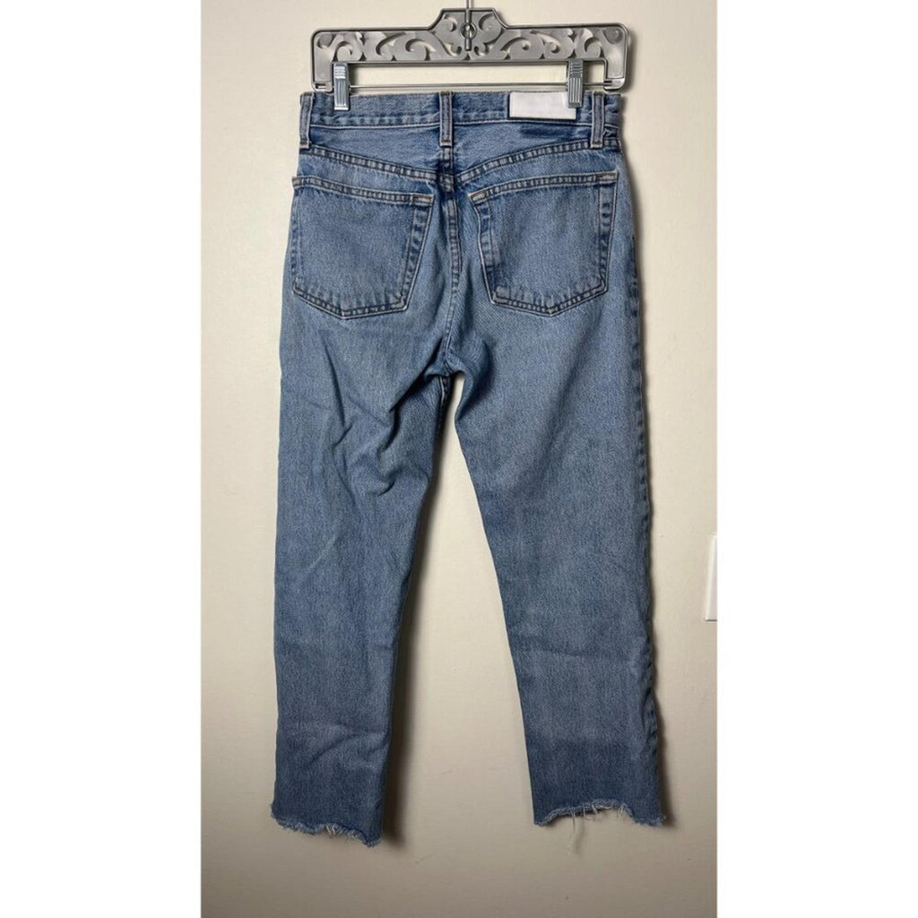 Back view of REDONE LEVIS VINTAGE DENIM JEANS showing distressed hem and classic pockets.