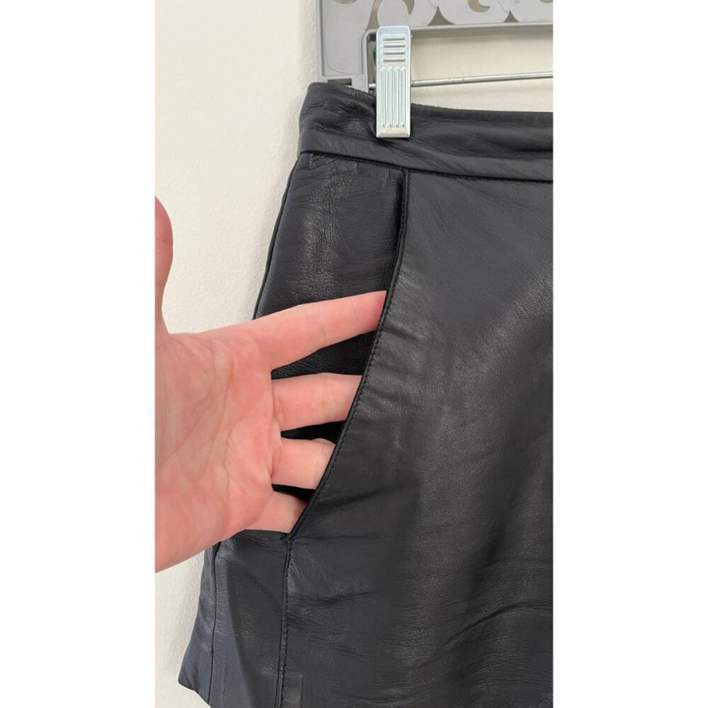 Close-up of MAJE LAMBSKIN LEATHER BIKER SHORTS showing pocket detail and soft texture.